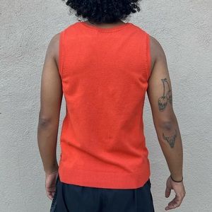 woman’s orange tank Size M
